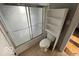 Bathroom with a shower-tub combination and functional storage space at 234 Ringwood Way, Anderson, IN 46013