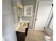Bathroom with a vintage vanity, medicine cabinet, and tiled floor at 234 Ringwood Way, Anderson, IN 46013