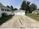 Detached garage with a concrete driveway and ample parking space at 234 Ringwood Way, Anderson, IN 46013