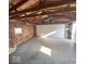 Unfinished garage space with exposed insulation and door to exterior at 234 Ringwood Way, Anderson, IN 46013