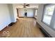 Spacious living room with hardwood floors, neutral walls, and natural light from windows at 234 Ringwood Way, Anderson, IN 46013