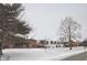 A street view in the winter of lovely homes, showcasing the neighborhood's charm and curb appeal at 5429 Channing Rd, Indianapolis, IN 46226