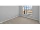 Cozy bedroom featuring neutral carpet, and a view of the neighborhood at 16920 Cattle Hollow Ln, Noblesville, IN 46060