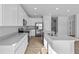 Modern, all-white kitchen with stainless steel appliances and a functional center island at 16920 Cattle Hollow Ln, Noblesville, IN 46060
