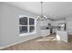 Bright kitchen with stainless steel appliances, white cabinets, and hardwood floors at 16920 Cattle Hollow Ln, Noblesville, IN 46060