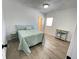 Cozy bedroom with a comfortable bed and light-colored floors, creating a serene and relaxing space at 728 E Beecher St, Indianapolis, IN 46203