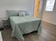 Inviting bedroom with a comfortable bed and light-colored floors, creating a serene and relaxing space at 728 E Beecher St, Indianapolis, IN 46203