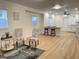 Bright and airy living area with stylish chairs, natural light, and open flow into the kitchen area at 728 E Beecher St, Indianapolis, IN 46203