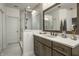 Bathroom featuring a modern vanity with a white countertop and frameless glass shower at 729 Greenford N Trl, Carmel, IN 46032