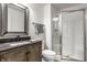 Modern bathroom featuring a vanity with unique mirror and glass-enclosed shower at 729 Greenford N Trl, Carmel, IN 46032