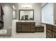 Bathroom with double vanity, wood cabinets, and a shower with glass enclosure at 729 Greenford N Trl, Carmel, IN 46032