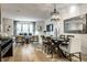 Dining area with rustic accents, modern chairs, and stylish mirror at 729 Greenford N Trl, Carmel, IN 46032