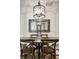 Elegant dining room setup with a rustic table, and overhead lighting at 729 Greenford N Trl, Carmel, IN 46032