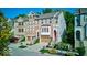 Charming townhomes with attached garages and landscaped front yards create curb appeal at 729 Greenford N Trl, Carmel, IN 46032