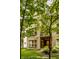 A tan brick apartment building surrounded by trees at 729 Greenford N Trl, Carmel, IN 46032
