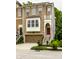 Charming two-story home with a brick and siding exterior, front-entry garage, and a red front door at 729 Greenford N Trl, Carmel, IN 46032