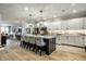 Spacious kitchen featuring a large center island with seating, stainless appliances, and modern cabinetry at 729 Greenford N Trl, Carmel, IN 46032
