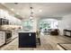 Modern kitchen with stainless steel appliances, a center island, and pendant lighting at 729 Greenford N Trl, Carmel, IN 46032