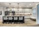 Spacious modern kitchen with stainless steel appliances, a large center island, and ample cabinet space at 729 Greenford N Trl, Carmel, IN 46032