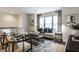 Spacious living room featuring stylish seating, a large window, and modern decor at 729 Greenford N Trl, Carmel, IN 46032