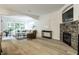 Bright living room with large windows, comfortable seating, and a stone fireplace at 729 Greenford N Trl, Carmel, IN 46032