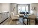 Comfortable living room with neutral furniture, large windows, and modern decor at 729 Greenford N Trl, Carmel, IN 46032