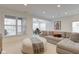 Cozy living room with a comfortable couch, plush ottoman, and a view of the outdoors at 729 Greenford N Trl, Carmel, IN 46032