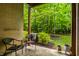 Covered patio offers outdoor seating and a view of the lush green backyard at 729 Greenford N Trl, Carmel, IN 46032