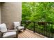 Inviting patio with comfortable chairs and potted flowers, overlooking lush greenery at 729 Greenford N Trl, Carmel, IN 46032