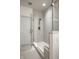 Modern walk-in shower featuring neutral tiling, a glass door, and sleek fixtures at 729 Greenford N Trl, Carmel, IN 46032