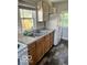 Kitchen with wood cabinets and a double sink at 304 Andover Rd, Anderson, IN 46013