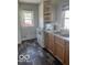 Small kitchen with wood cabinets and white appliances at 304 Andover Rd, Anderson, IN 46013