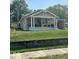 Charming single story home with a covered front porch and an American flag at 217 Ringwood Way, Anderson, IN 46013