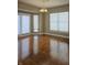 Sunlit dining room showcasing hardwood floors and large windows at 10870 Picket Fence Pl, Fishers, IN 46037