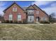 Charming two-story brick home with manicured landscaping and a classic architectural design at 10870 Picket Fence Pl, Fishers, IN 46037