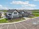Aerial view of a clubhouse showcasing modern farmhouse architecture, parking, and landscaping at 231 Lar Lan Dr, Danville, IN 46122
