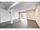 Finished basement featuring neutral paint, sliding glass door, and concrete flooring at 5515 Shorewood Dr, Indianapolis, IN 46220