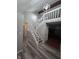 Modern staircase with white railings and wooden steps at 7932 Eagle Valley Pass, Indianapolis, IN 46214