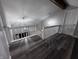 Open railing and modern light fixtures in the upper hallway at 7932 Eagle Valley Pass, Indianapolis, IN 46214
