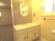 This bathroom features a vanity with storage, a mirror and a neutral colored paint at 431 Vestal Rd, Plainfield, IN 46168