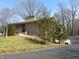 Charming single-story home with stone and siding exterior and mature trees on a well-maintained lot at 431 Vestal Rd, Plainfield, IN 46168