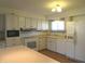 Traditional kitchen with white appliances and cabinetry with ample counter space at 431 Vestal Rd, Plainfield, IN 46168