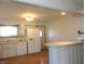 Kitchen featuring a breakfast bar, white cabinets, and appliances at 431 Vestal Rd, Plainfield, IN 46168