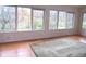 Light-filled living room featuring hardwood floors and large windows with outdoor views at 431 Vestal Rd, Plainfield, IN 46168