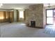 Living room boasting stone fireplace, front door access, and neutral carpet at 431 Vestal Rd, Plainfield, IN 46168