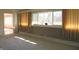 Living room featuring large windows and neutral carpet at 431 Vestal Rd, Plainfield, IN 46168