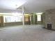 Spacious living room featuring a stone fireplace, carpeted floors and many windows providing natural light at 431 Vestal Rd, Plainfield, IN 46168