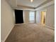 Carpeted bedroom with window, and access to bathroom at 3534 Brampton Ln, Westfield, IN 46074