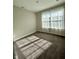 Bright bedroom with carpeted floor and large window at 3534 Brampton Ln, Westfield, IN 46074