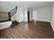 Open living area with wood-look floors and staircase at 3534 Brampton Ln, Westfield, IN 46074